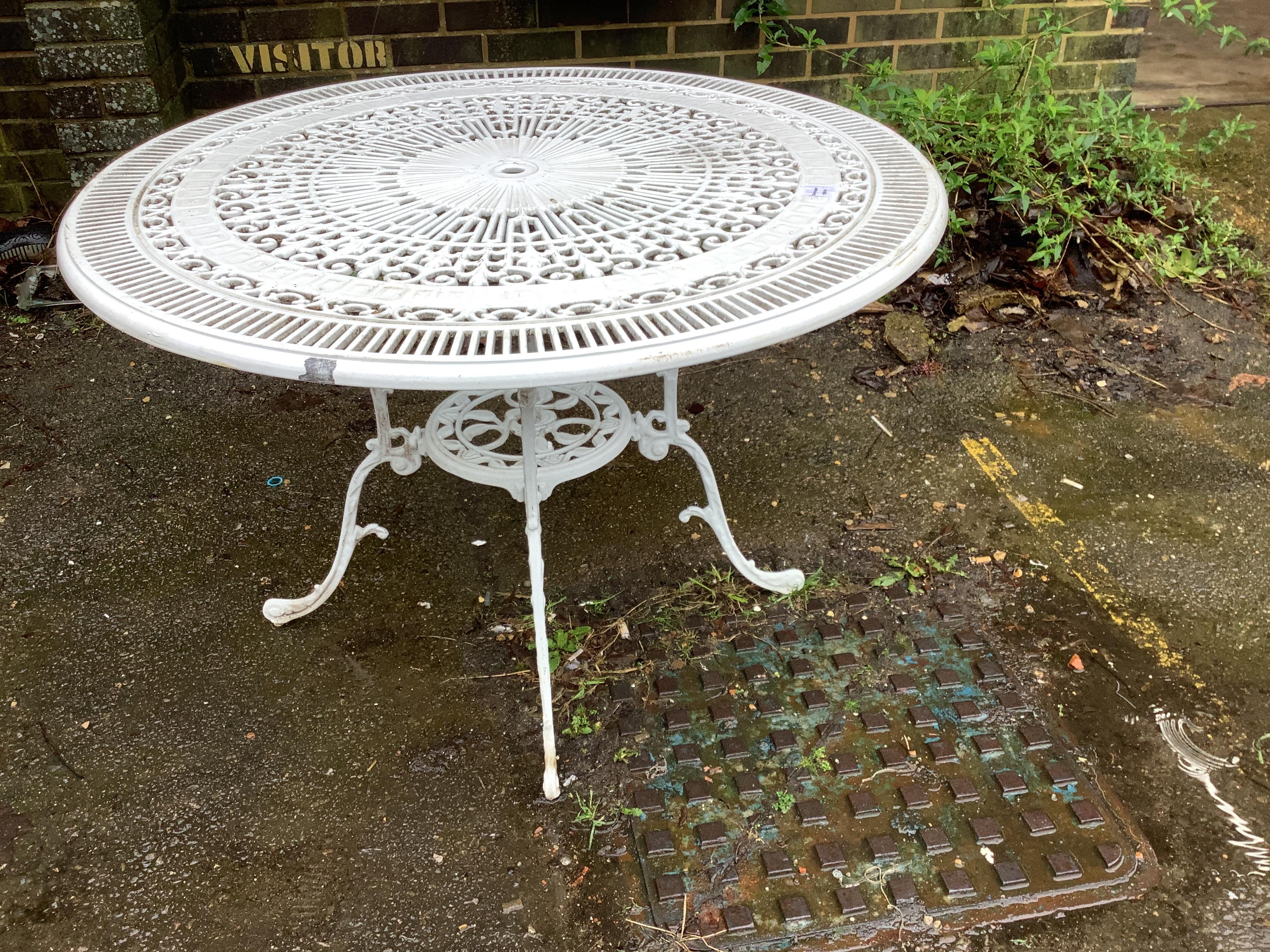 A Victorian style circular white painted cast aluminium garden table, diameter 103cm, height 68cm